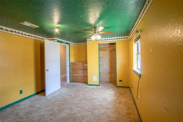 a view of empty room with painted walls