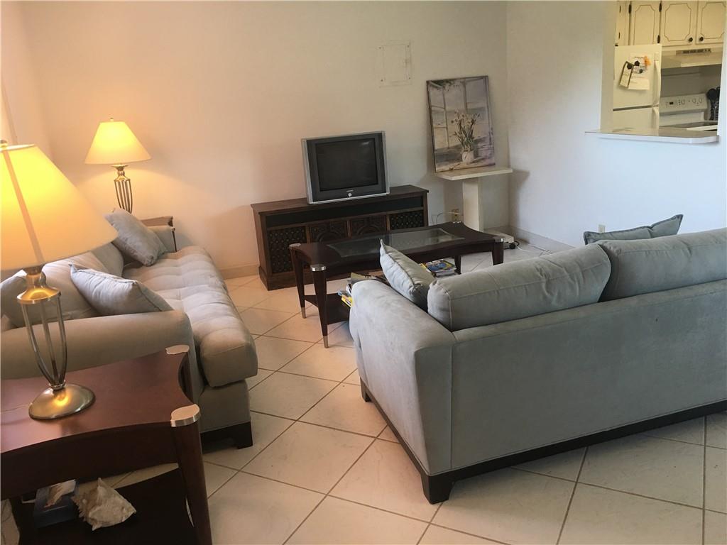 Kings Point Delray Beach, FL 33446 - Photo 1 of 7 a living room with furniture and a flat screen tv