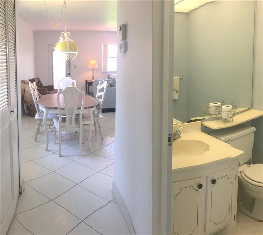 Kings Point Delray Beach, FL 33446 - Photo 6 of 7 a bathroom with a sink vanity and a mirror