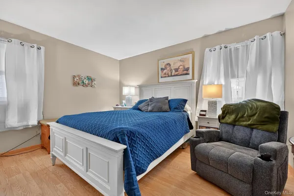 a spacious bedroom with a bed and a couch