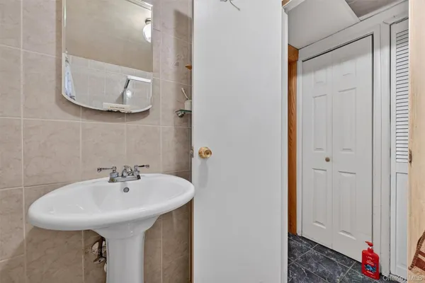 a bathroom with a sink and a mirror