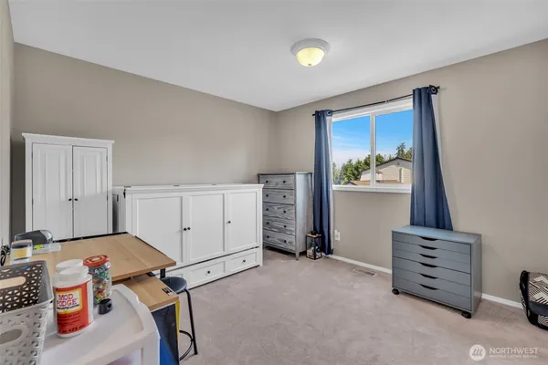 a room with furniture and white walls