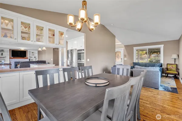 a view of a dining room with furniture and a livingroom