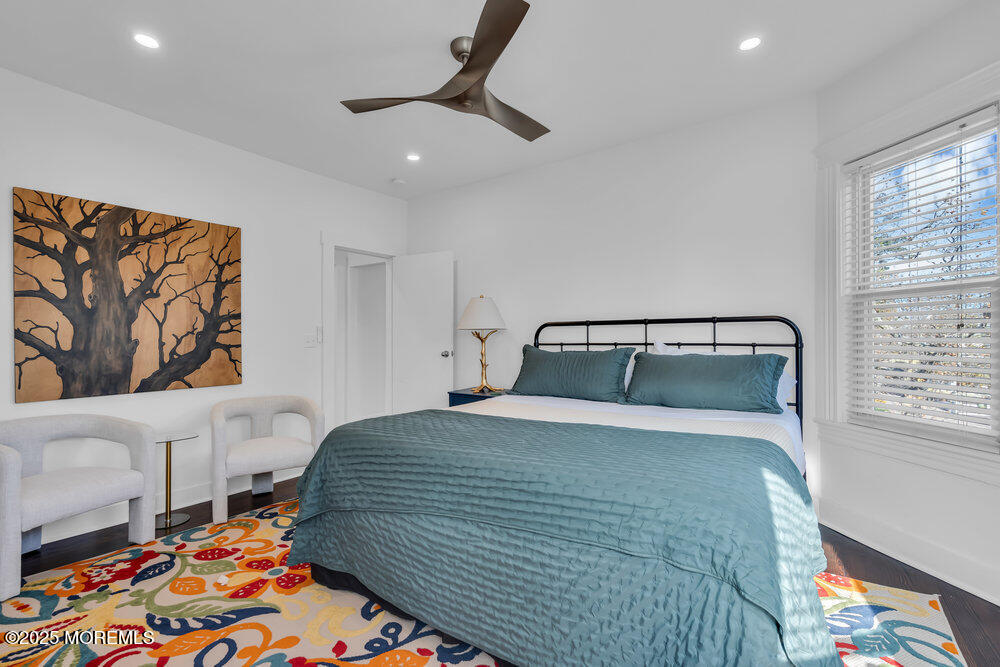 1200 Sunset Avenue Asbury Park, NJ 07712 - Photo 15 of 57 a bedroom with a bed and a painting on the wall