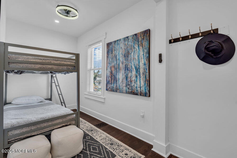 1200 Sunset Avenue Asbury Park, NJ 07712 - Photo 17 of 57 a bathroom with a granite countertop sink a mirror and a shower