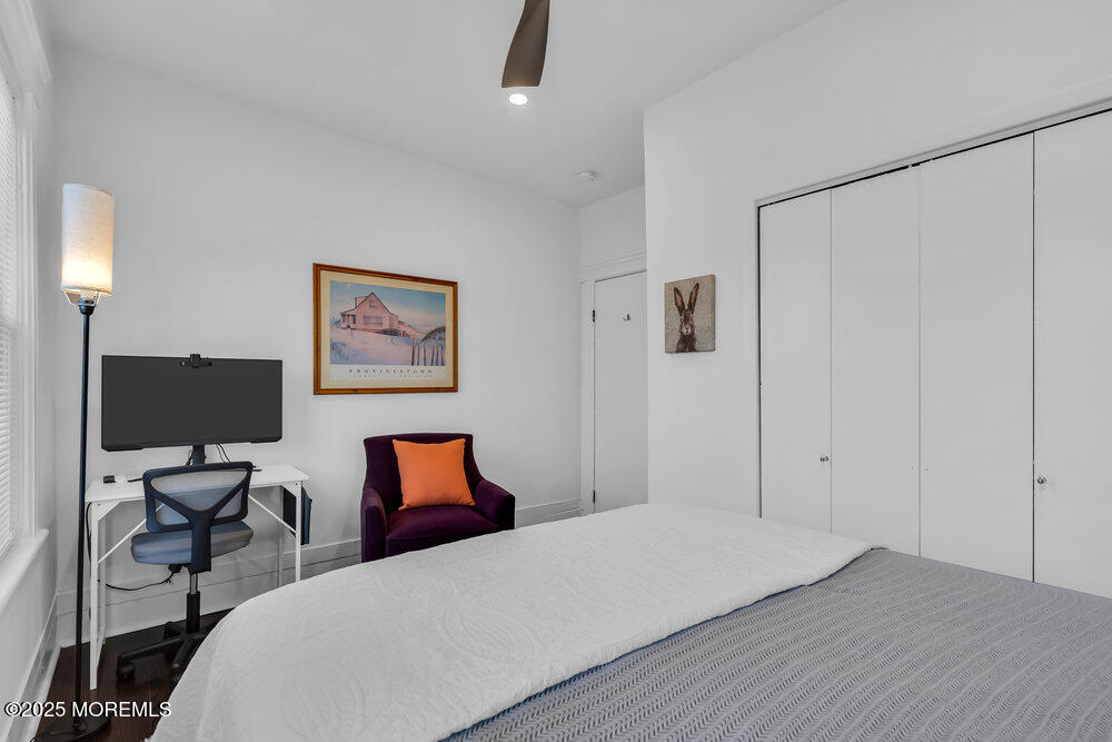 1200 Sunset Avenue Asbury Park, NJ 07712 - Photo 19 of 57 a bedroom with a bed and a lamp on table