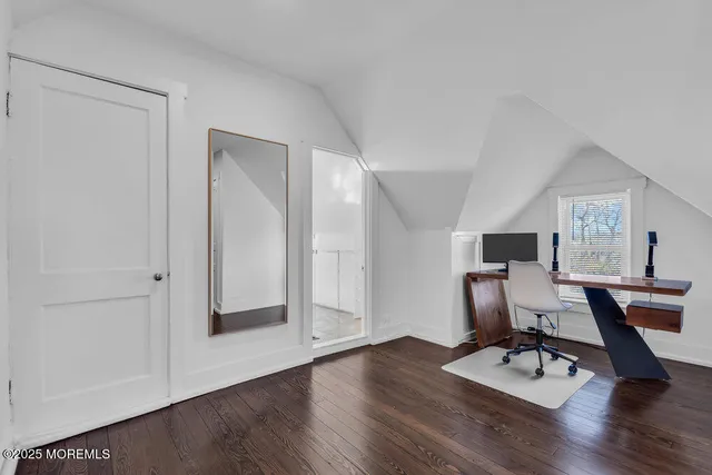 an aerial view of multiple houses with yard