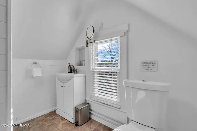 a white bench sitting in the middle of a house