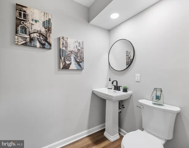 a bathroom with a toilet and a sink