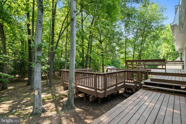 a view of balcony with wooden floor and outdoor seating