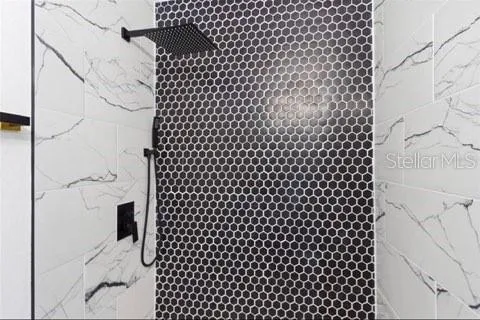 a bathroom with a black white checkered floor