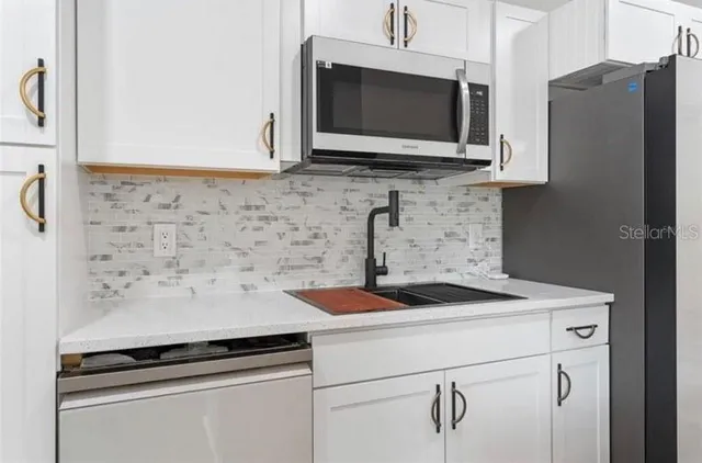 a kitchen with a stove and a microwave