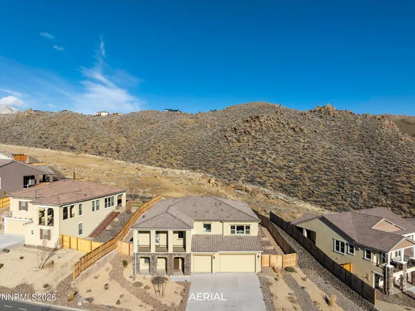 a view of a big room with a mountain in the background