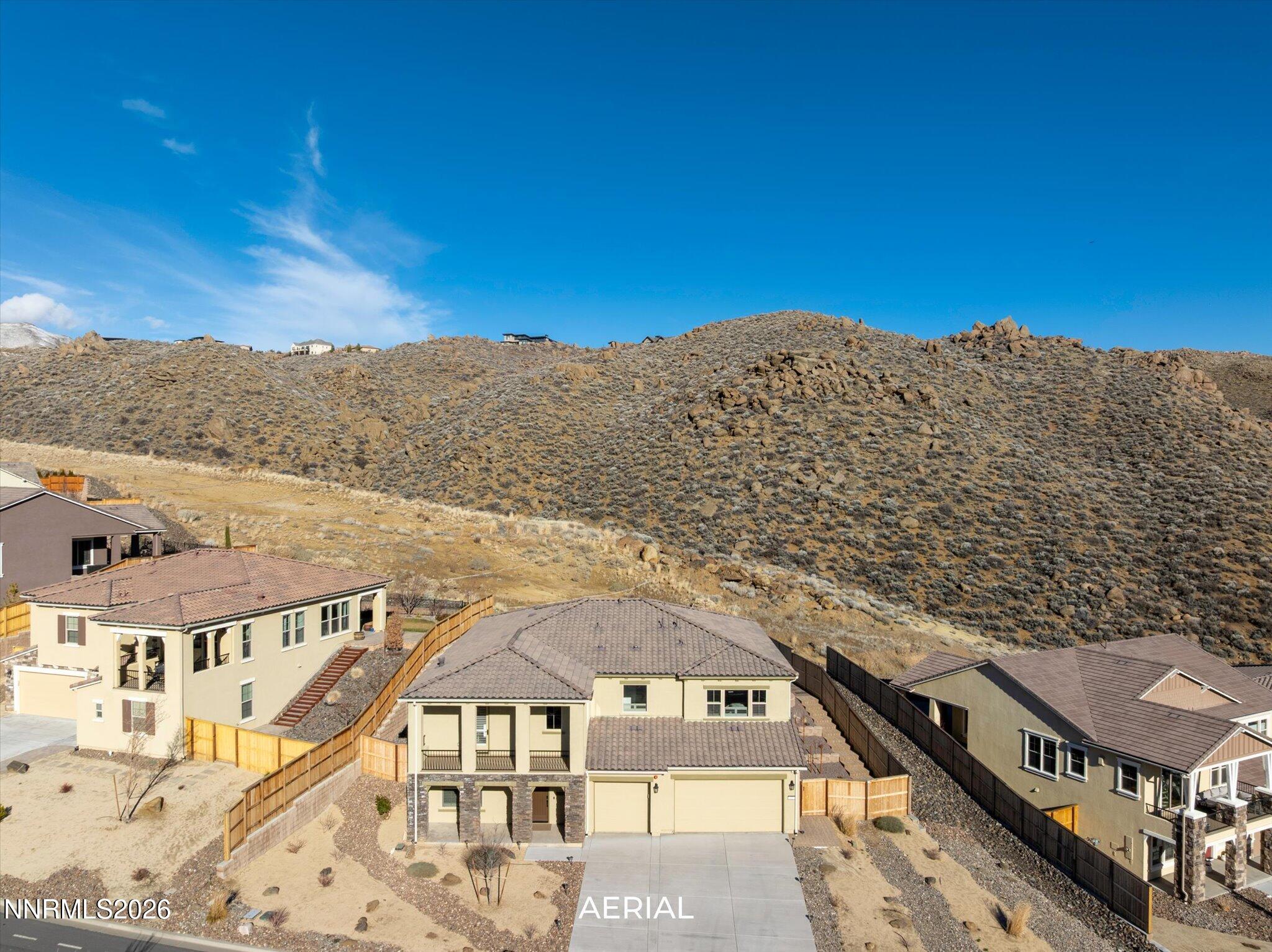 415 Gooseberry Drive Reno, NV 89523 - Photo 1 of 32 a view of a big room with a mountain in the background