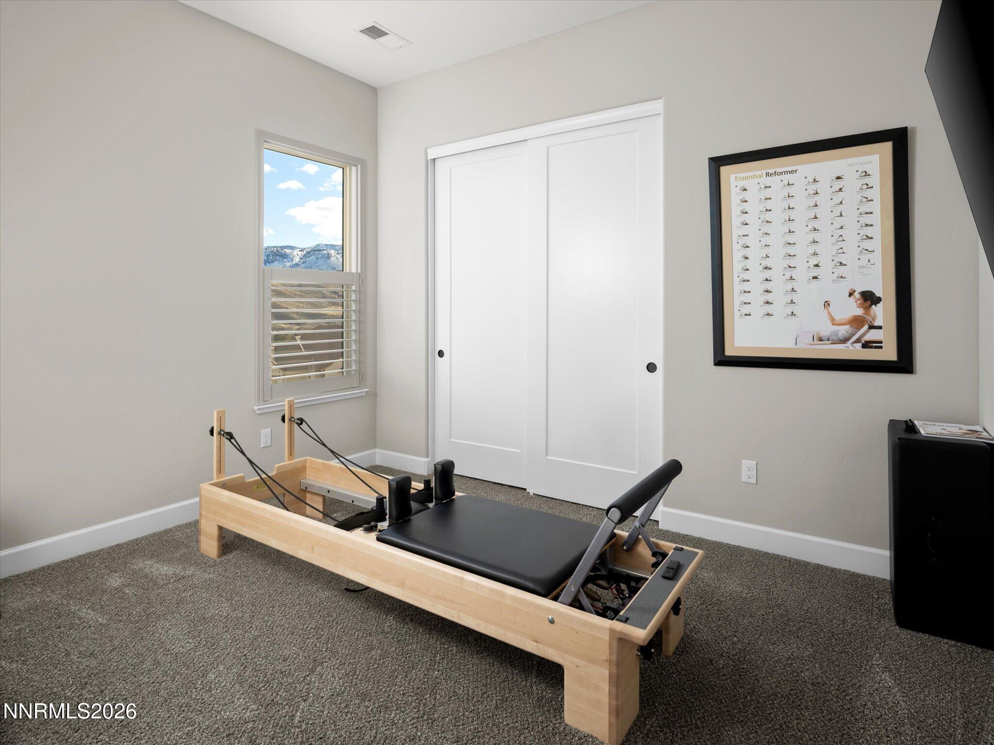 415 Gooseberry Drive Reno, NV 89523 - Photo 12 of 32 a room with gym equipment and a window
