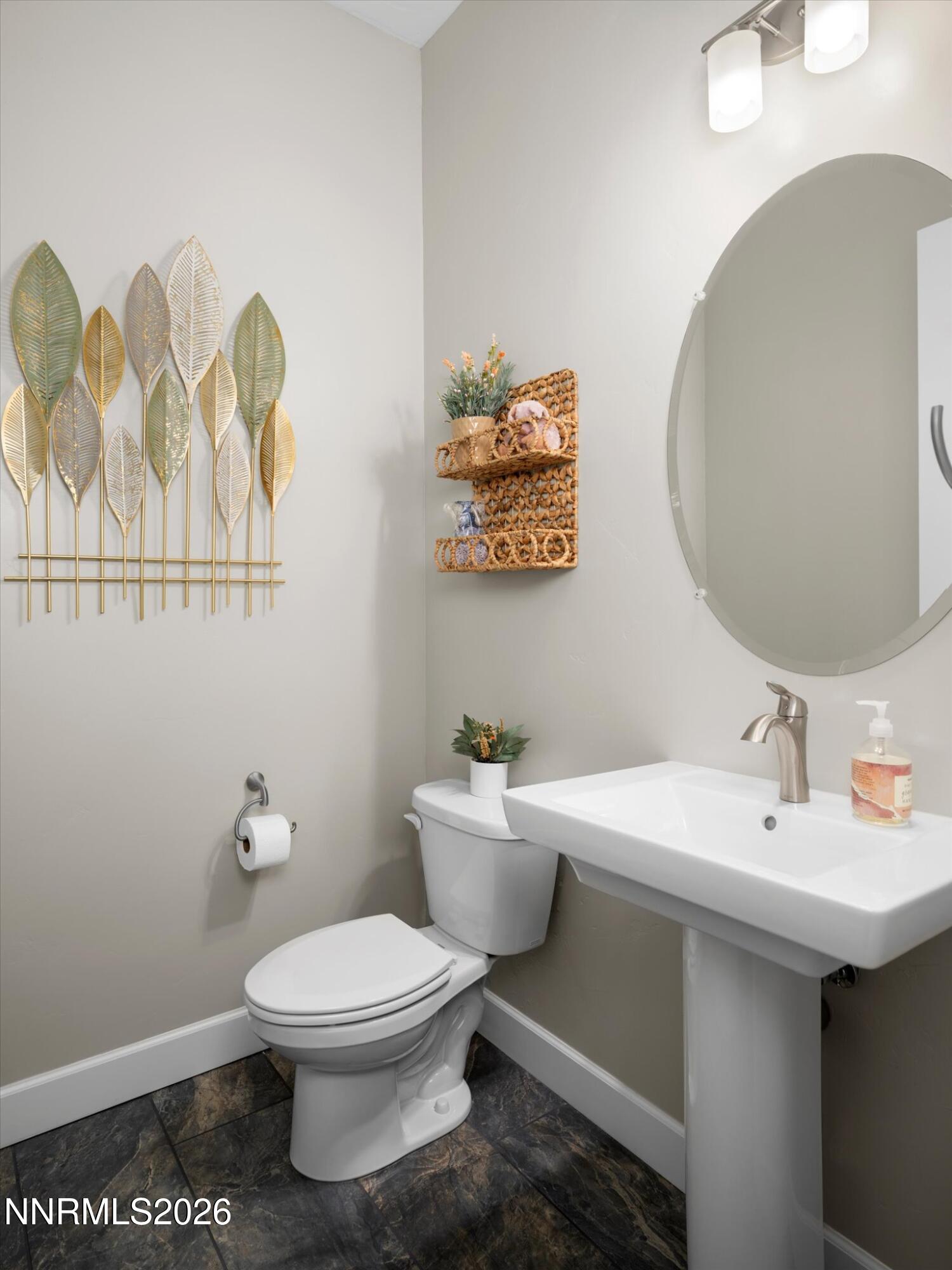 415 Gooseberry Drive Reno, NV 89523 - Photo 13 of 32 a bathroom with a toilet a sink and mirror