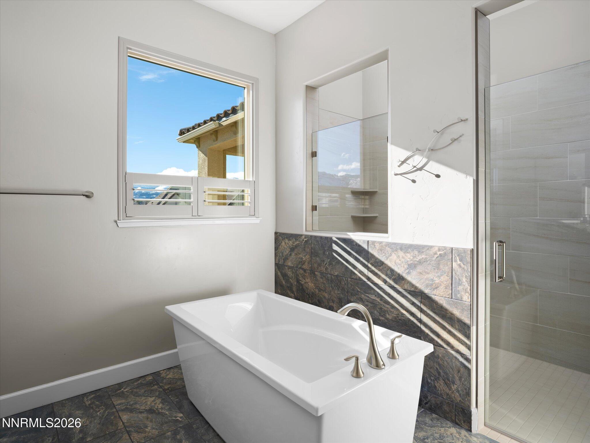 415 Gooseberry Drive Reno, NV 89523 - Photo 17 of 32 a bathroom with a bathtub and a sink