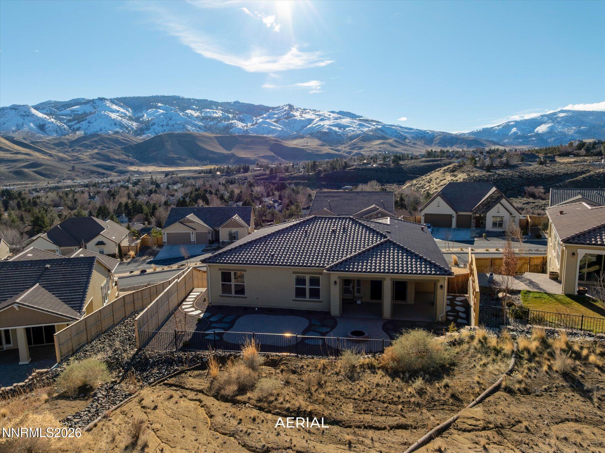 415 Gooseberry Drive Reno, NV 89523 - Photo 25 of 32 a view of a big house with a mountain in the background
