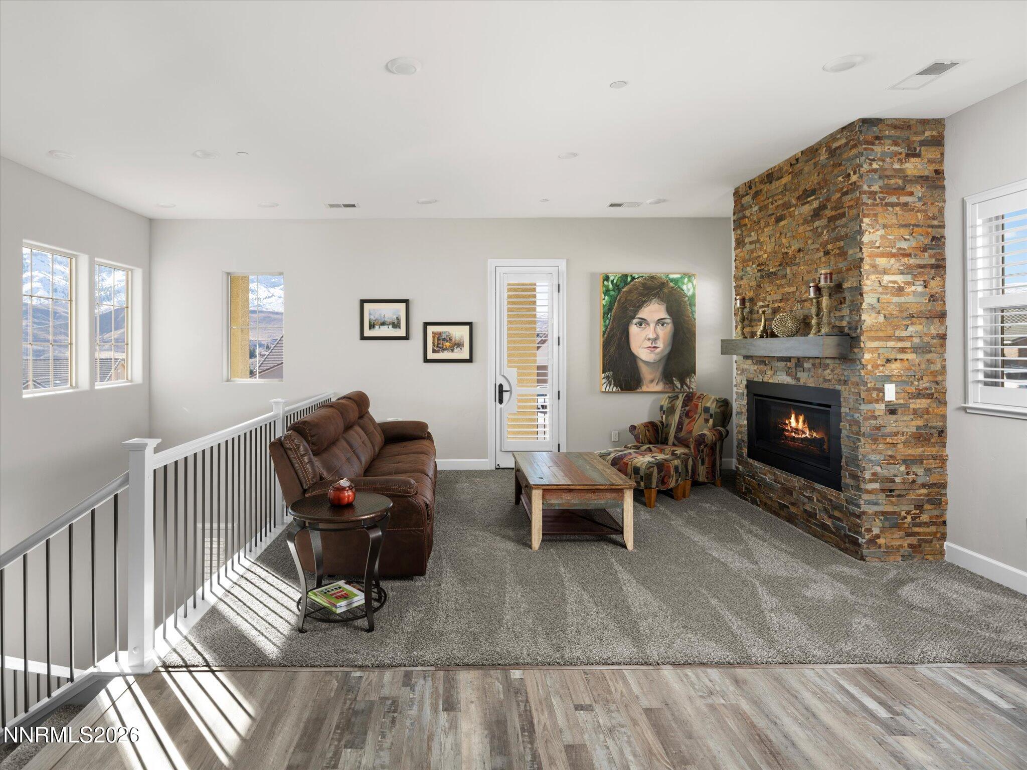 415 Gooseberry Drive Reno, NV 89523 - Photo 9 of 32 a living room with furniture and a fireplace