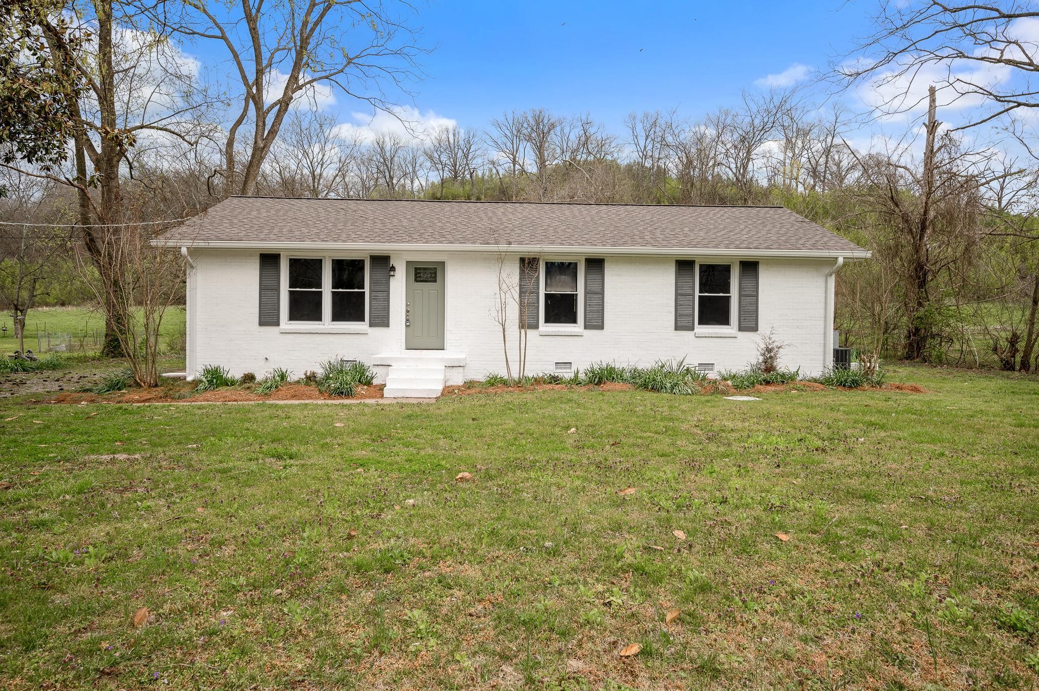 1080 Slaters Creek Road Goodlettsville, TN 37072 - Photo 1 of 22 a front view of house with yard and trees