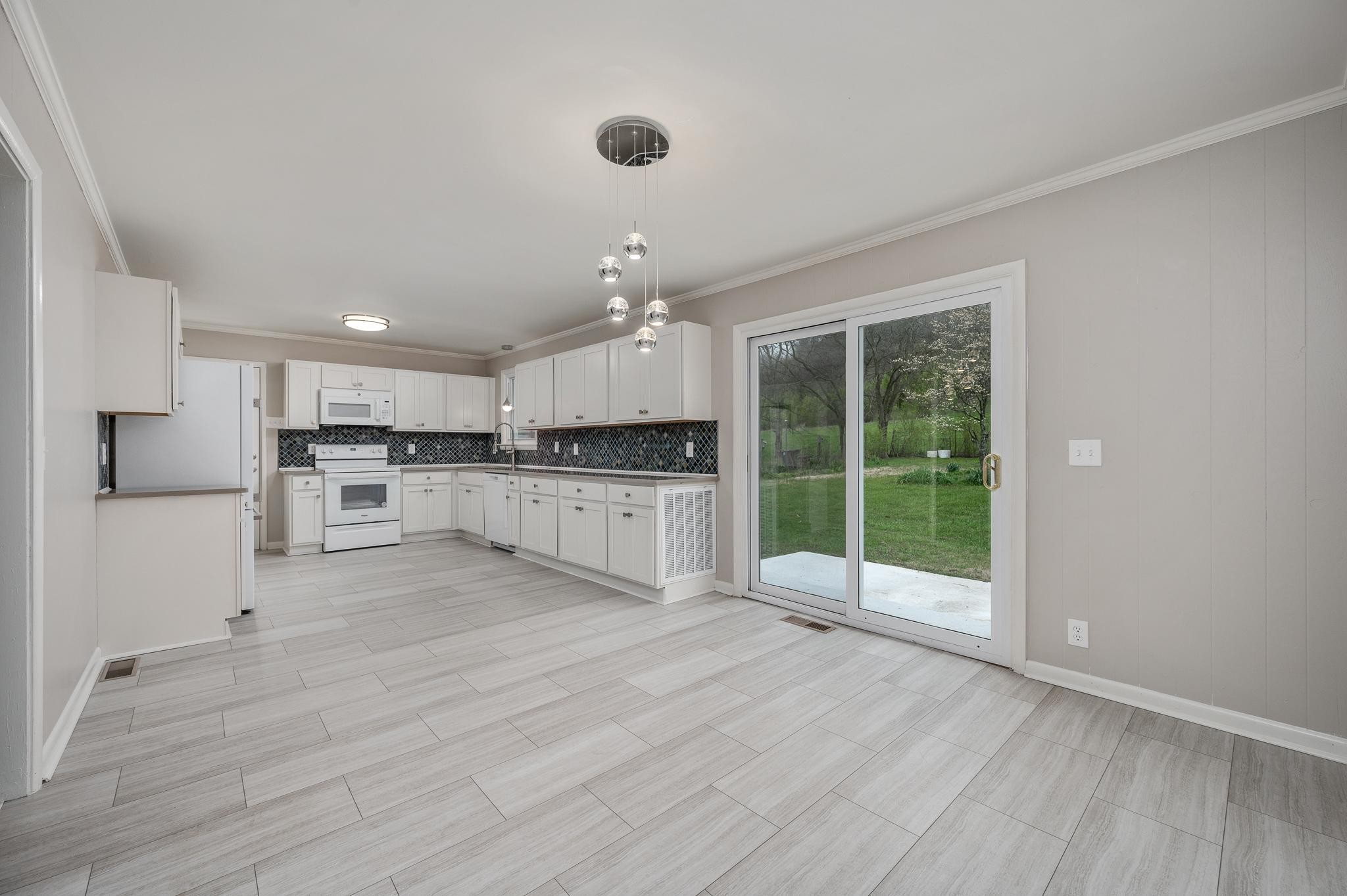 1080 Slaters Creek Road Goodlettsville, TN 37072 - Photo 11 of 22 a view of a kitchen with a sink and a large window