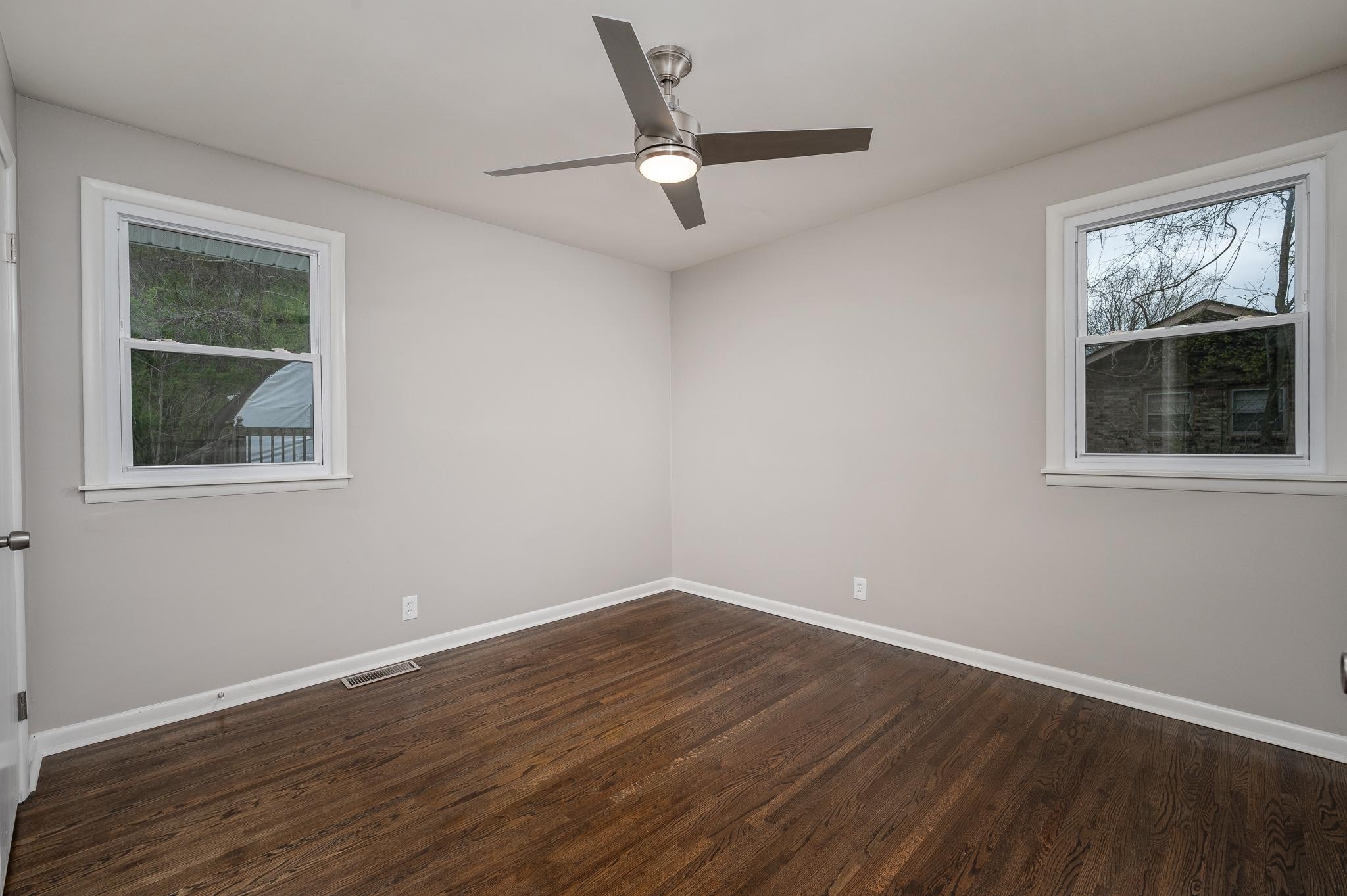 1080 Slaters Creek Road Goodlettsville, TN 37072 - Photo 15 of 22 a view of empty room with wooden floor and fan