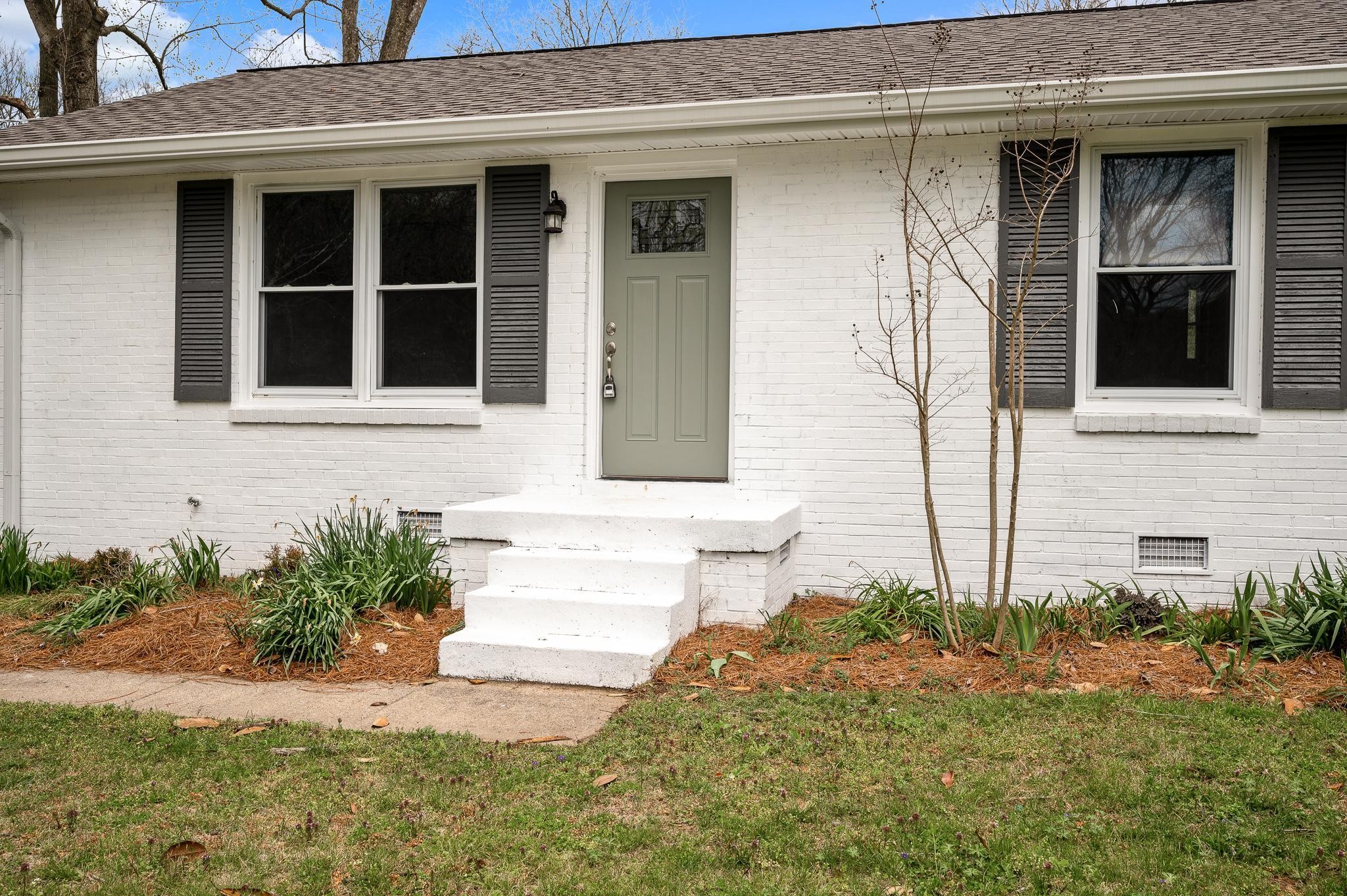 1080 Slaters Creek Road Goodlettsville, TN 37072 - Photo 3 of 22 a front view of a house with a yard