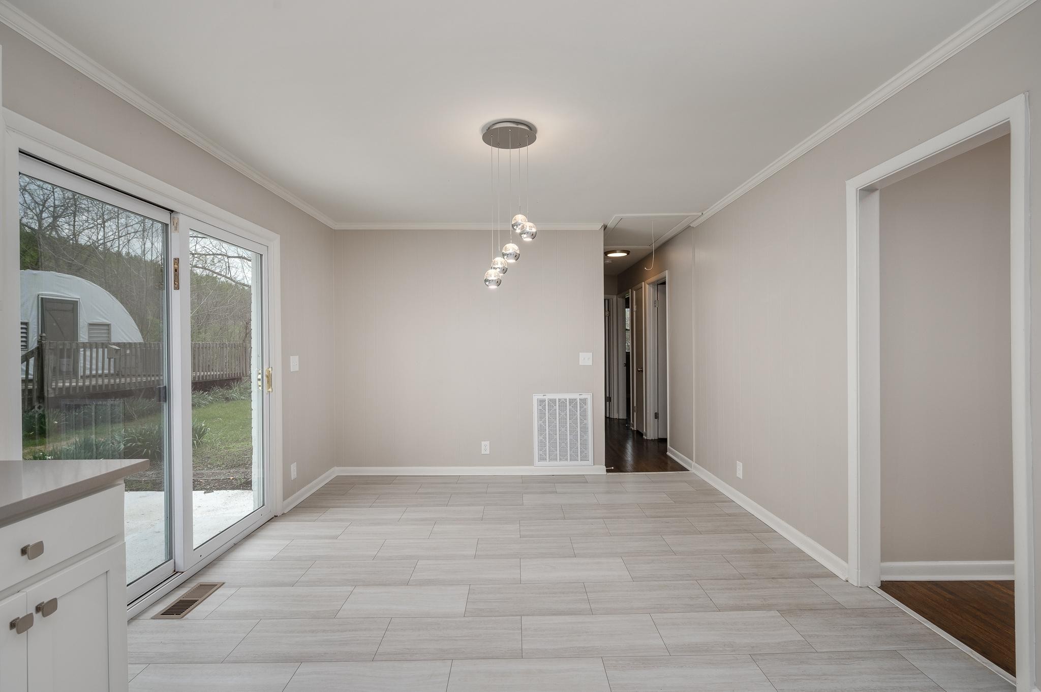 1080 Slaters Creek Road Goodlettsville, TN 37072 - Photo 4 of 22 a view of hallway with a large window and chandelier