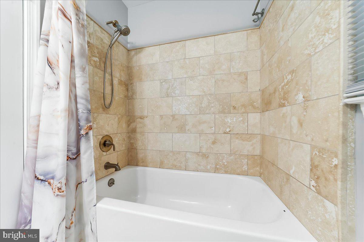 686 Limehouse Road Wayne, PA 19087 - Photo 40 of 51 a bathroom with a shower and a bath tub