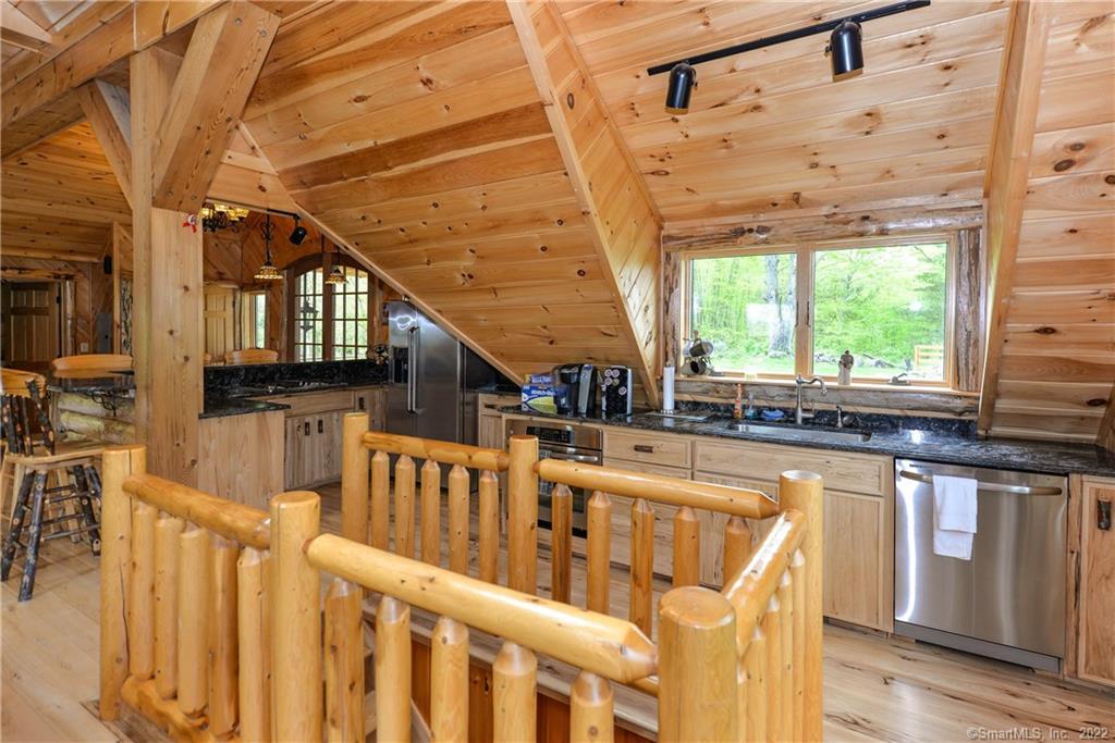555 West Purchase Road Southbury, CT 06488 - Photo 6 of 15 a view of a house with wooden deck and furniture
