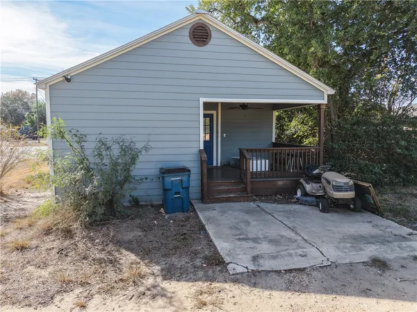 a view of house with outdoor seating area