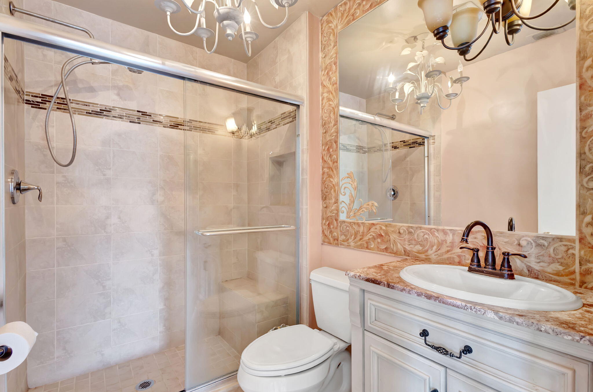 6458 Chasewood Drive, Unit E Jupiter, FL 33458 - Photo 11 of 33 a bathroom with a sink a toilet and shower