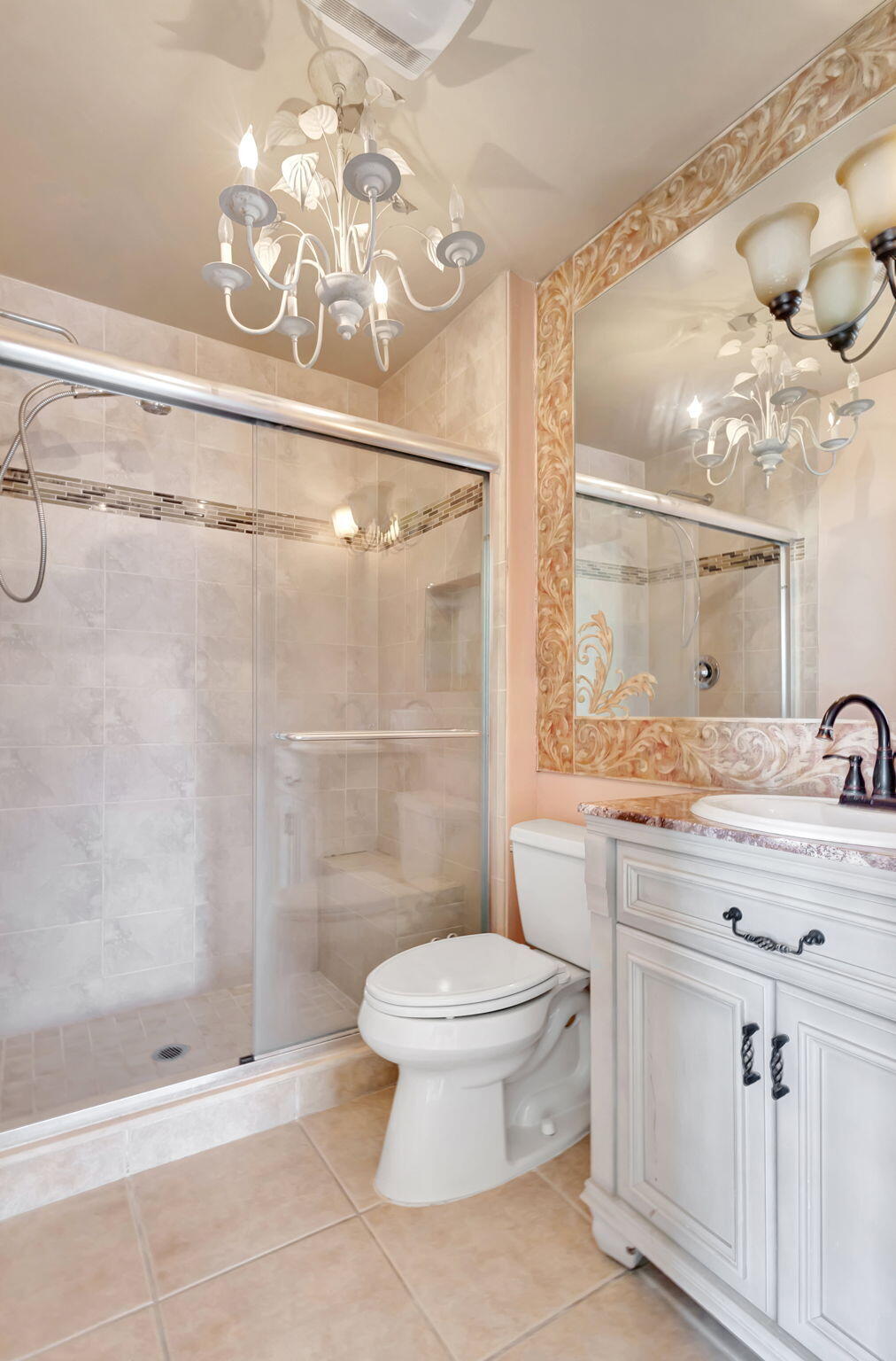 6458 Chasewood Drive, Unit E Jupiter, FL 33458 - Photo 12 of 33 a bathroom with a granite countertop sink a toilet and shower