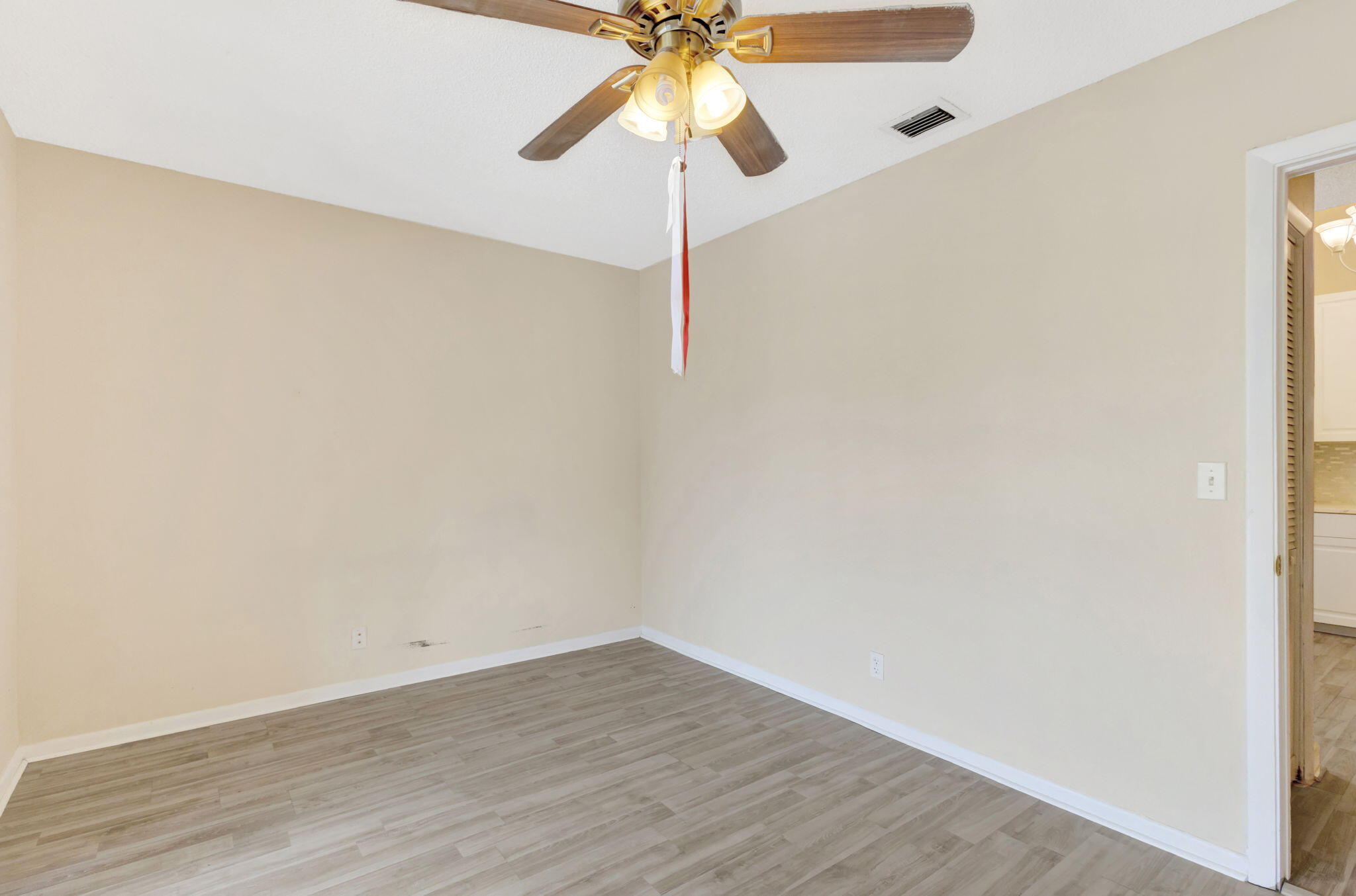 6458 Chasewood Drive, Unit E Jupiter, FL 33458 - Photo 16 of 33 a view of a room with wooden floor
