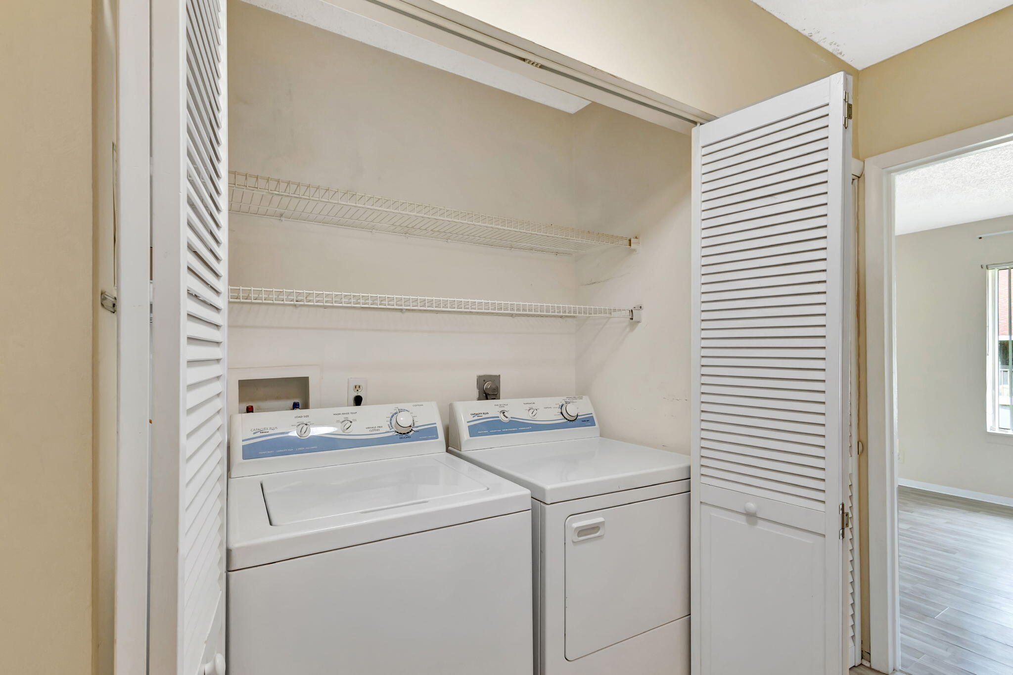 6458 Chasewood Drive, Unit E Jupiter, FL 33458 - Photo 19 of 33 a utility room with dryer and washer