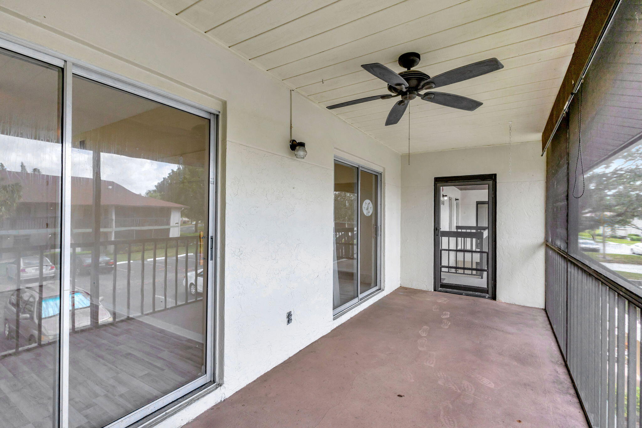 6458 Chasewood Drive, Unit E Jupiter, FL 33458 - Photo 27 of 33 a view of a room with a ceiling fan and window