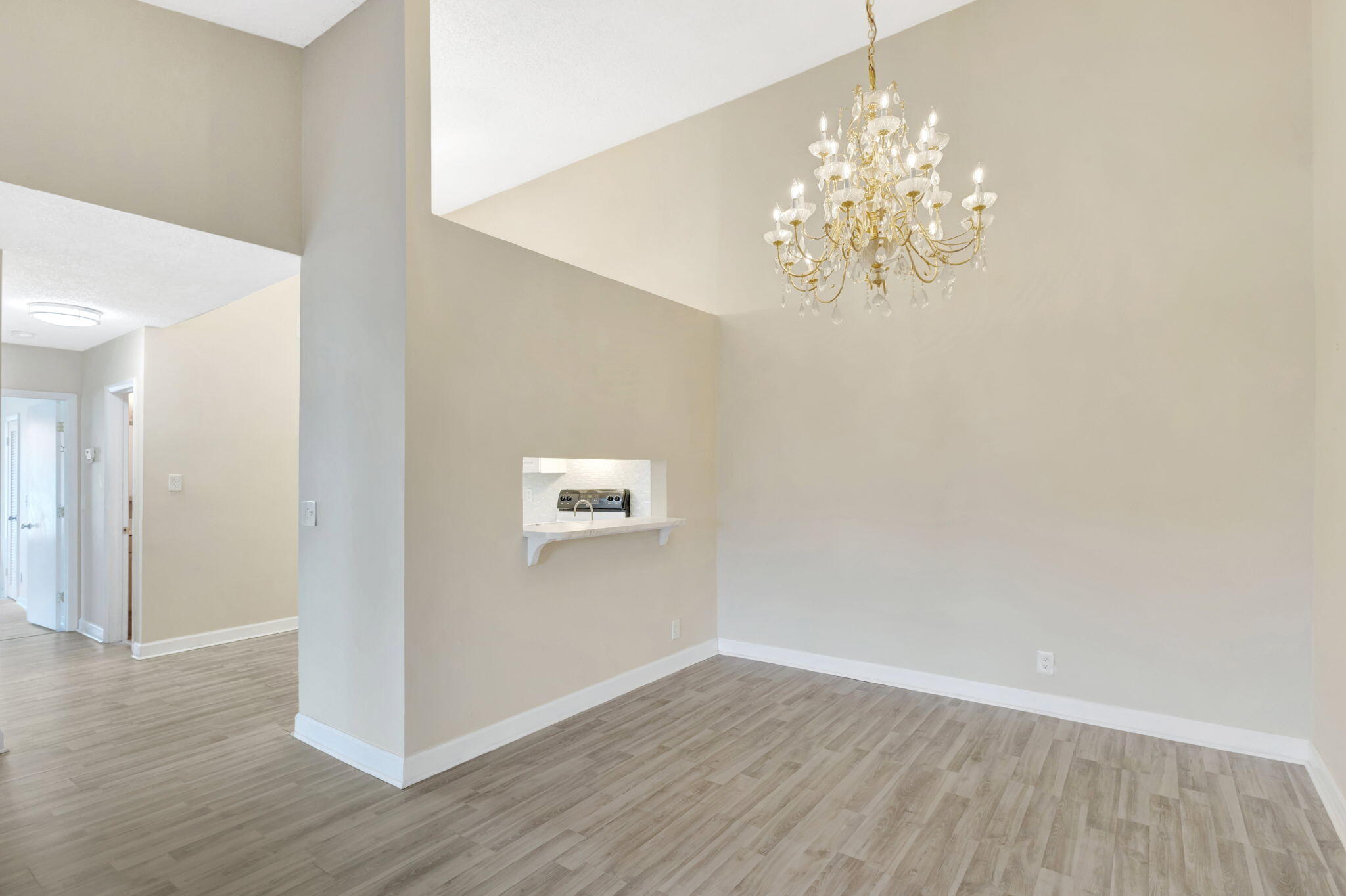 6458 Chasewood Drive, Unit E Jupiter, FL 33458 - Photo 5 of 33 a view of an empty room with wooden floor