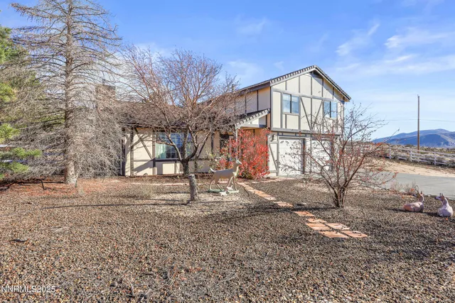 a kitchen with stainless steel appliances granite countertop a sink a stove cabinets and a kitchen island
