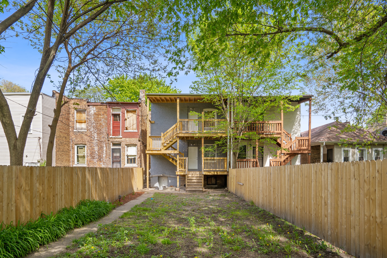 6826 South Prairie Avenue, Unit 1 Chicago, IL 60637 - Photo 19 of 20 a view of a house with a yard