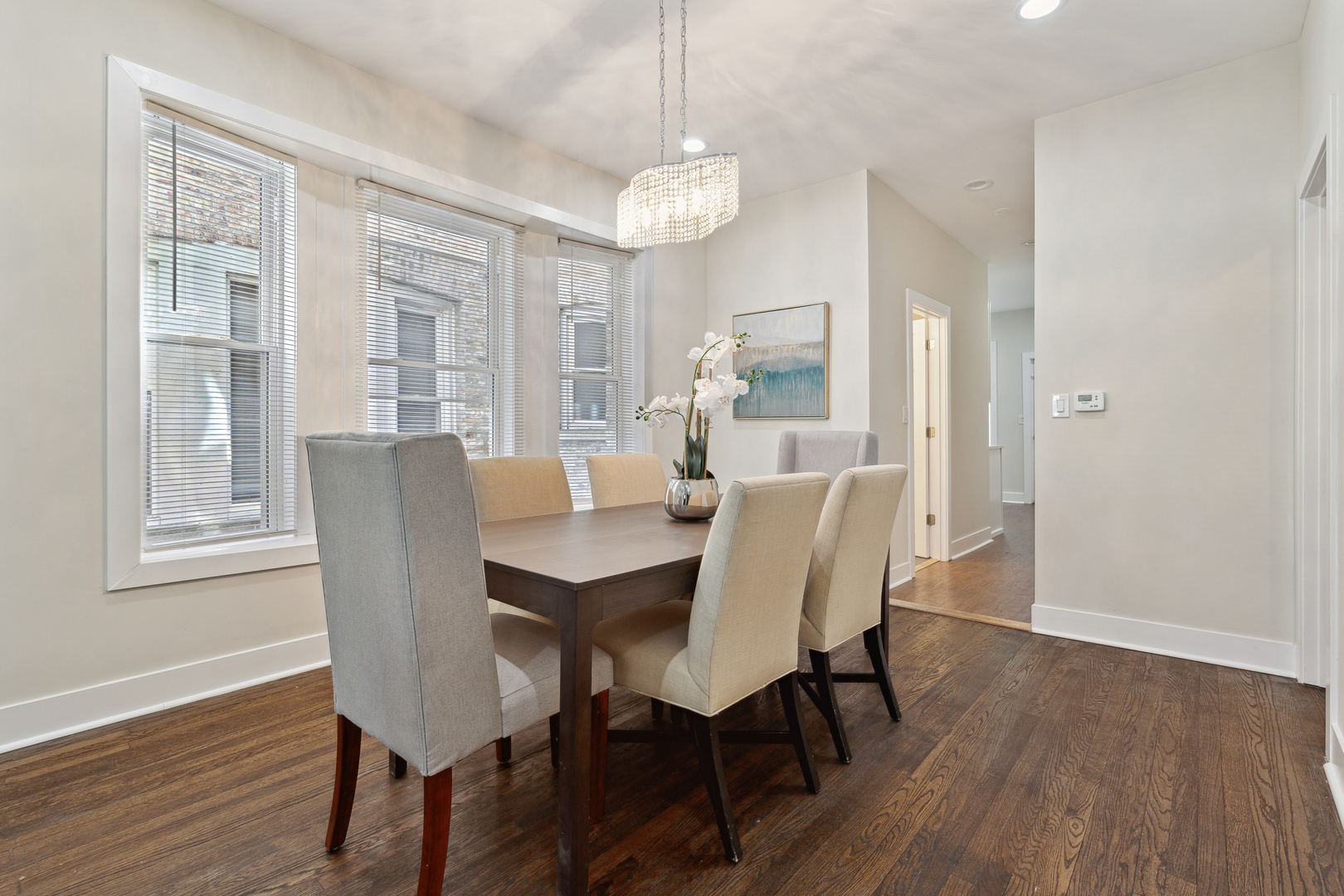 6826 South Prairie Avenue, Unit 1 Chicago, IL 60637 - Photo 6 of 20 a view of a dining room with furniture wooden floor and chandelier