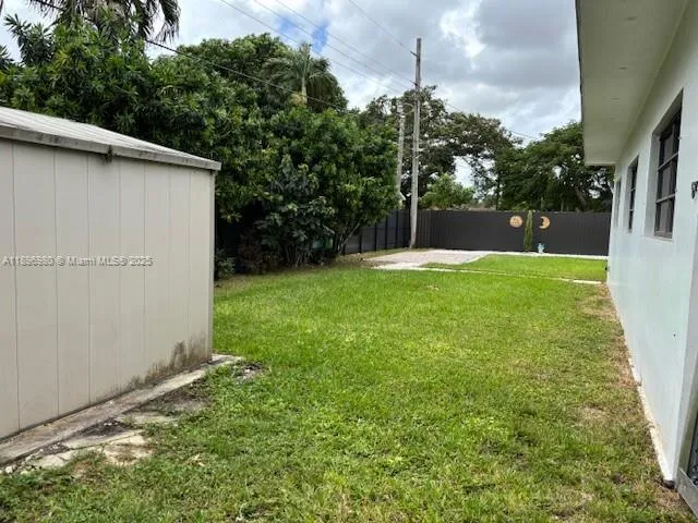 a view of backyard with green space
