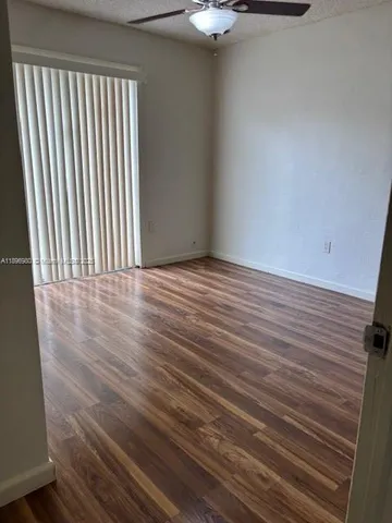 wooden floor in a hall with an entryway