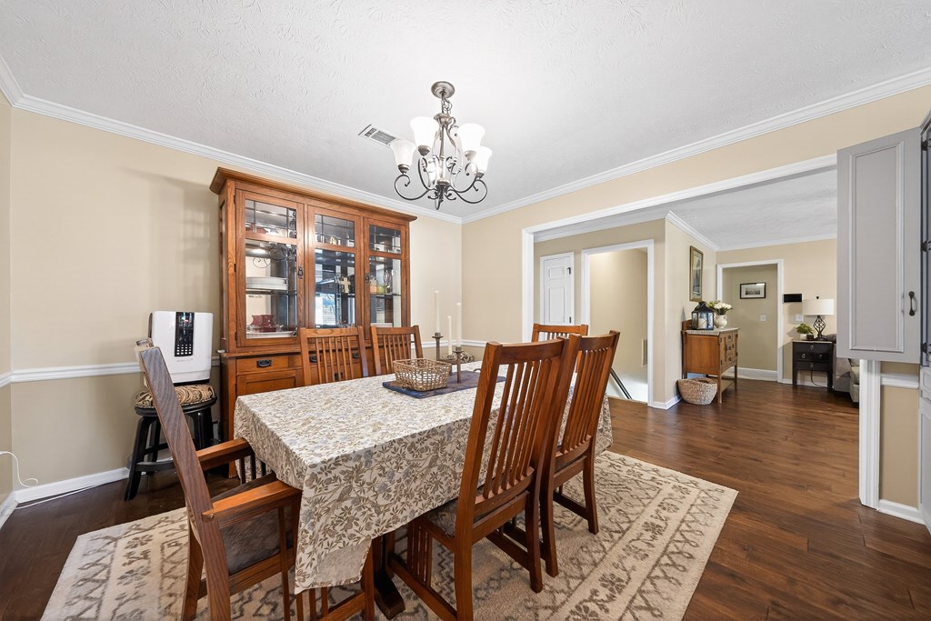 7333 Cedar Creek Loop Columbus, GA 31904 - Photo 4 of 37 a view of a dining room with furniture and wooden floor