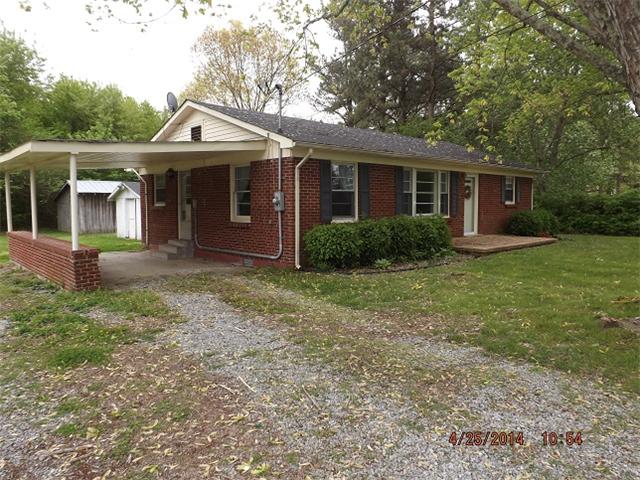 591 Florence Pulaski Road Leoma, TN 38468 - Photo 1 of 12 a front view of a house with garden