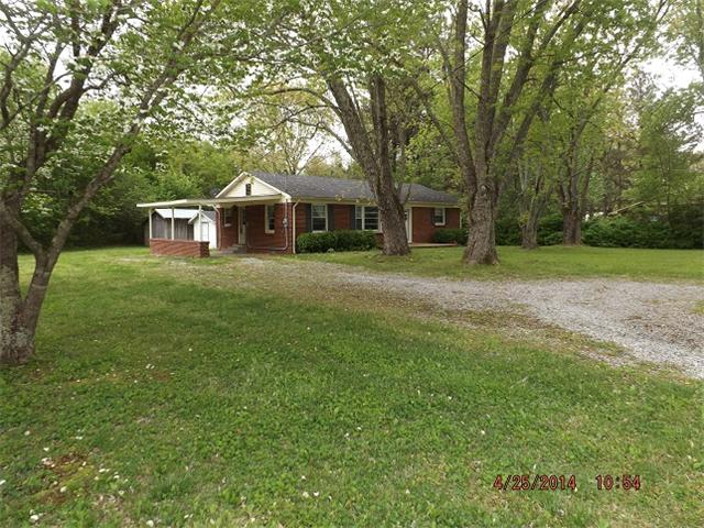591 Florence Pulaski Road Leoma, TN 38468 - Photo 11 of 12 a front view of a house with a yard