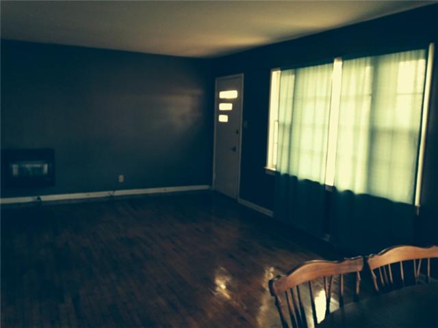 591 Florence Pulaski Road Leoma, TN 38468 - Photo 3 of 12 a view of an empty room with wooden floor and a window