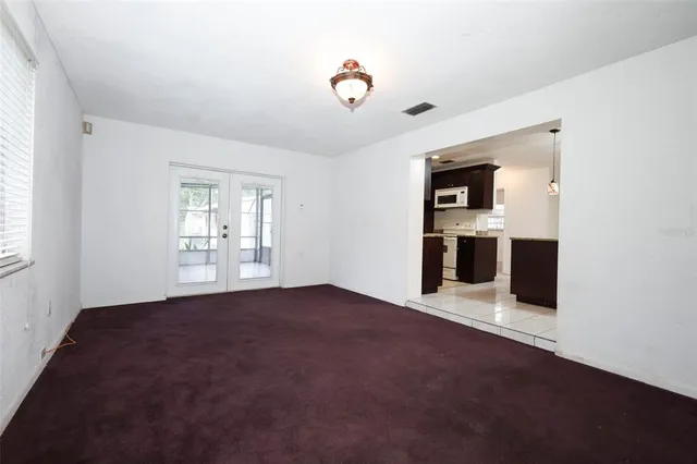 a view of empty room with front door