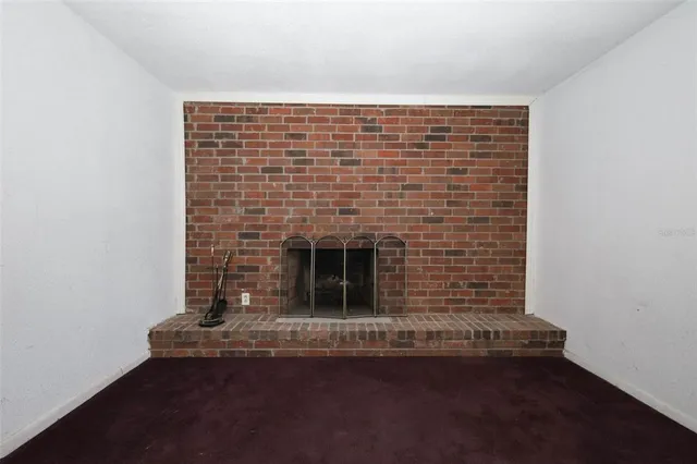 a view of fireplace and wooden floor