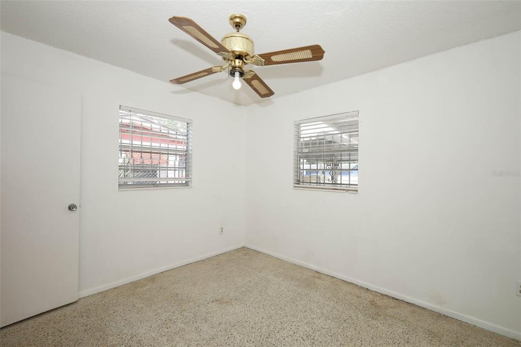 124 Salem Street Altamonte Springs, FL 32701 - Photo 26 of 45 an empty room with wooden floor and windows