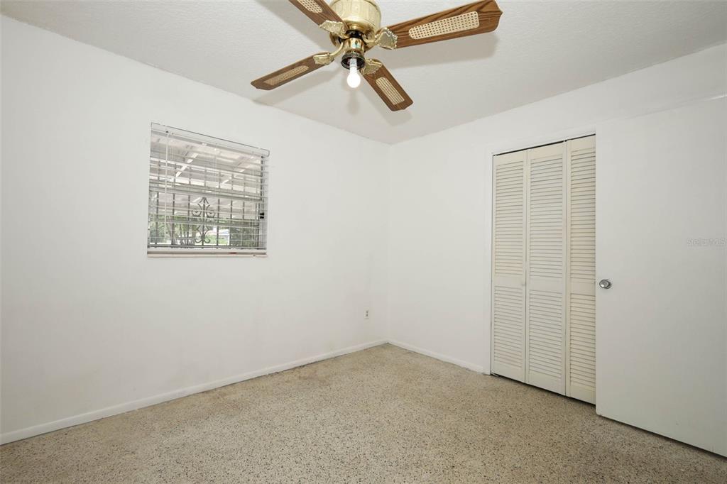 124 Salem Street Altamonte Springs, FL 32701 - Photo 27 of 45 an empty room with a window and a fan